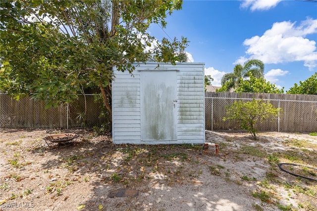 view of shed with a fenced backyard