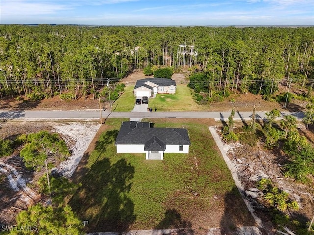 bird's eye view featuring a forest view
