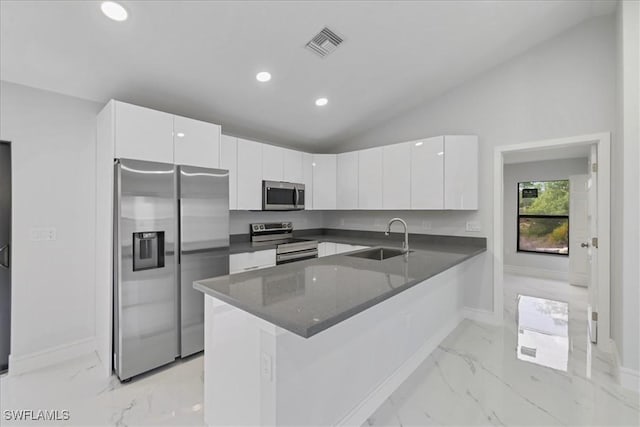 kitchen featuring visible vents, a sink, marble finish floor, and appliances with stainless steel finishes
