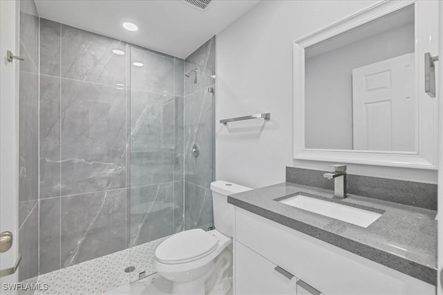 full bathroom with vanity, recessed lighting, a marble finish shower, and toilet