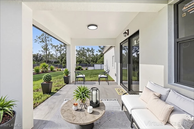 view of patio featuring fence and an outdoor living space