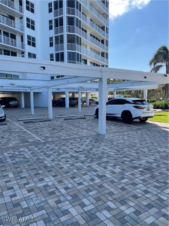 view of partially covered parking lot