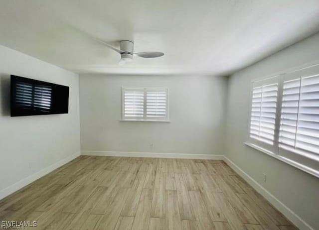 3650 1st Ave SW, Naples, FL 34117 - unfurnished room with baseboards, a ceiling fan, and light wood-style floors
