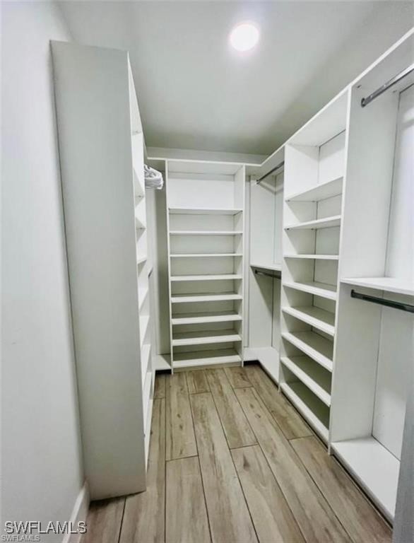 3650 1st Ave SW, Naples, FL 34117 - walk in closet featuring light wood-type flooring
