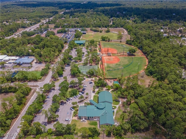 3650 1st Ave SW, Naples, FL 34117 - birds eye view of property featuring a view of trees