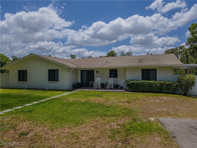 3650 1st Ave SW, Naples, FL 34117 - ranch-style home with a front yard and stucco siding