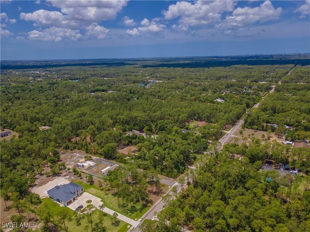 3650 1st Ave SW, Naples, FL 34117 - aerial view featuring a wooded view