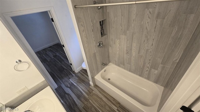 7311 Sean Ln, North Fort Myers, FL 33917 - full bath featuring shower / bathtub combination and wood finished floors