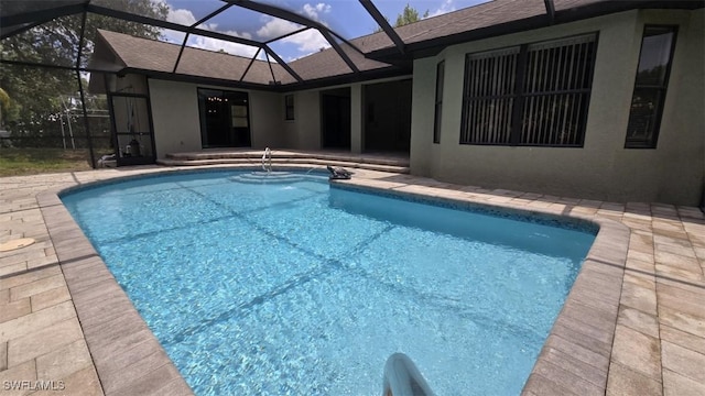 7311 Sean Ln, North Fort Myers, FL 33917 - outdoor pool featuring a patio area and glass enclosure