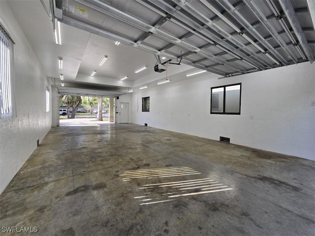 7311 Sean Ln, North Fort Myers, FL 33917 - garage with a garage door opener and a textured wall
