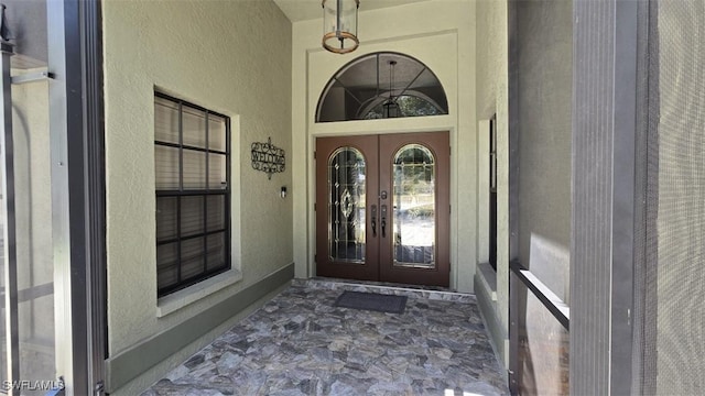 7311 Sean Ln, North Fort Myers, FL 33917 - entrance to property featuring french doors and stucco siding