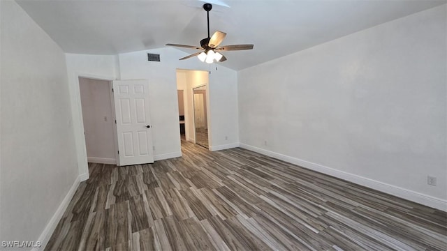 7311 Sean Ln, North Fort Myers, FL 33917 - unfurnished bedroom with lofted ceiling, wood finished floors, baseboards, and ceiling fan