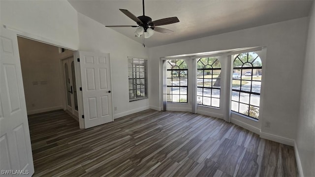 7311 Sean Ln, North Fort Myers, FL 33917 - unfurnished room with baseboards, ceiling fan, dark wood-style floors, and lofted ceiling
