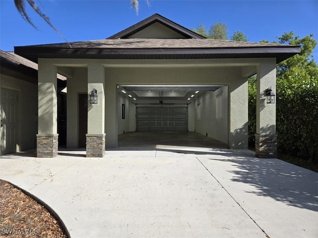 7311 Sean Ln, North Fort Myers, FL 33917 - view of front of home with stucco siding, concrete driveway, and an attached garage