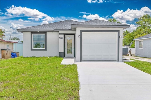 2174 Highland Ave, Fort Myers, FL 33916 - ranch-style house featuring a front lawn, concrete driveway, roof with shingles, stucco siding, and a garage