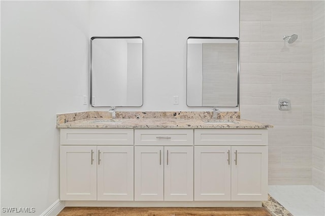 2174 Highland Ave, Fort Myers, FL 33916 - bathroom with a tile shower and double vanity