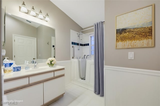 6731 Blake Pledger Ct, North Fort Myers, FL 33917 - bathroom featuring vanity, tile patterned flooring, vaulted ceiling, and visible vents