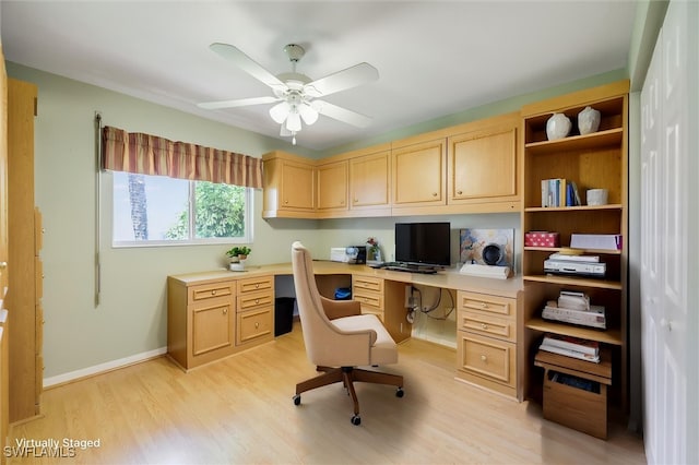 6731 Blake Pledger Ct, North Fort Myers, FL 33917 - office space featuring built in study area, a ceiling fan, light wood-style floors, and baseboards