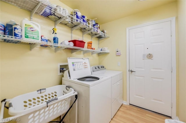 6731 Blake Pledger Ct, North Fort Myers, FL 33917 - laundry room featuring laundry area, washer and clothes dryer, and light wood finished floors