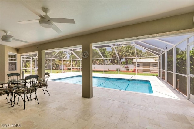 6731 Blake Pledger Ct, North Fort Myers, FL 33917 - view of swimming pool featuring a fenced in pool, a ceiling fan, a patio area, a storage shed, and an outbuilding