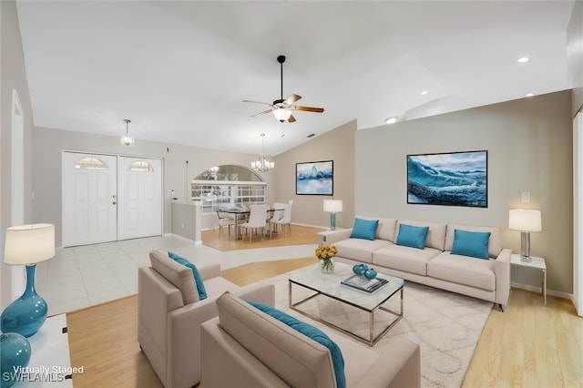6731 Blake Pledger Ct, North Fort Myers, FL 33917 - living room with ceiling fan with notable chandelier, recessed lighting, baseboards, wood finished floors, and vaulted ceiling