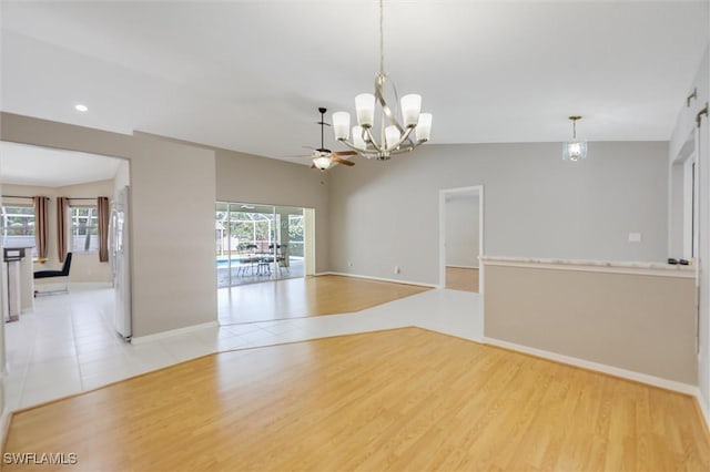 6731 Blake Pledger Ct, North Fort Myers, FL 33917 - spare room with recessed lighting, baseboards, ceiling fan with notable chandelier, and light wood-style floors
