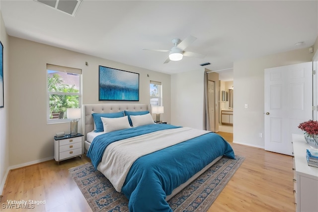 6731 Blake Pledger Ct, North Fort Myers, FL 33917 - bedroom with visible vents, light wood-style flooring, and multiple windows