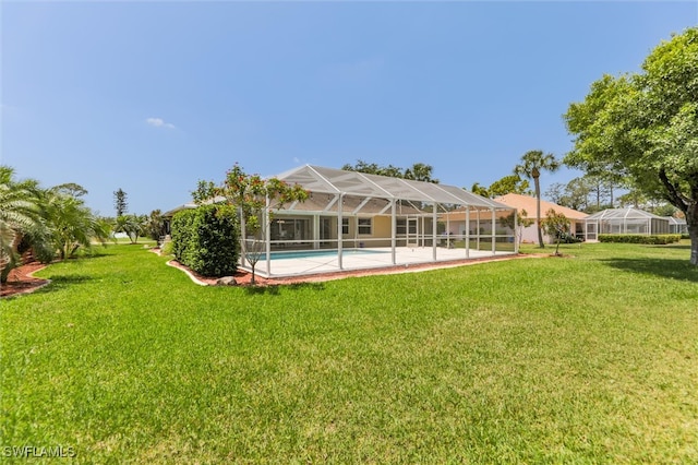 6731 Blake Pledger Ct, North Fort Myers, FL 33917 - rear view of property featuring a lawn, a lanai, and an outdoor pool