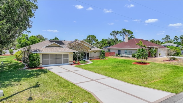 6731 Blake Pledger Ct, North Fort Myers, FL 33917 - ranch-style house with fence, an attached garage, a front lawn, stucco siding, and driveway