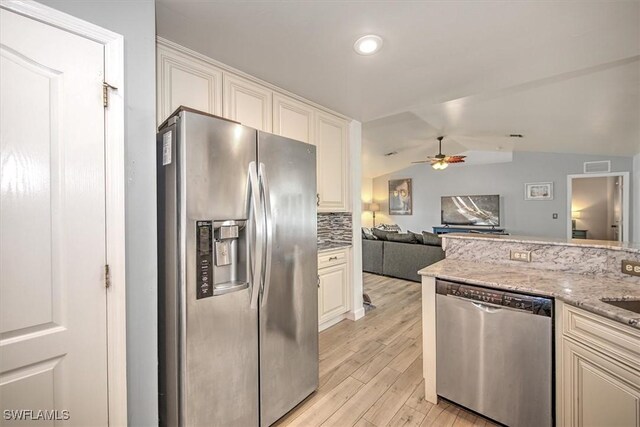 1137 Nelson Rd N, Cape Coral, FL 33993 - kitchen with visible vents, lofted ceiling, light wood-style floors, ceiling fan, and appliances with stainless steel finishes