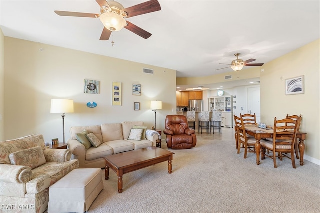 5781 Cape Harbour Dr Unit 610, Cape Coral, FL 33914 - living room featuring visible vents, a ceiling fan, and light carpet