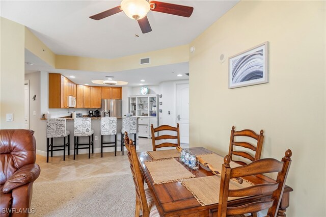 5781 Cape Harbour Dr Unit 610, Cape Coral, FL 33914 - dining space featuring light tile patterned floors, a ceiling fan, and visible vents