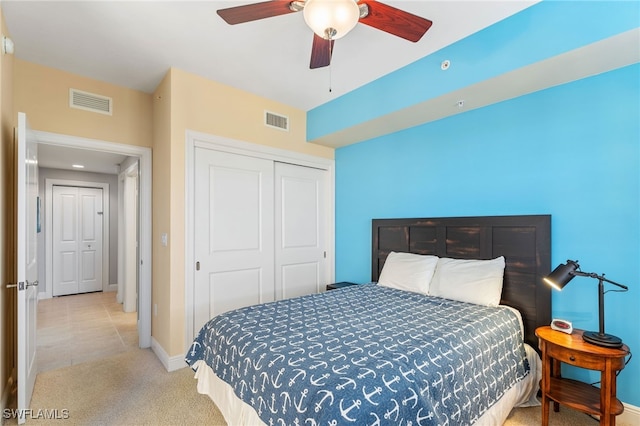5781 Cape Harbour Dr Unit 610, Cape Coral, FL 33914 - bedroom featuring baseboards, light carpet, a closet, and visible vents