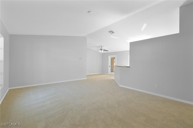 1401 NW 16th Pl, Cape Coral, FL 33993 - unfurnished living room with light colored carpet, baseboards, and lofted ceiling