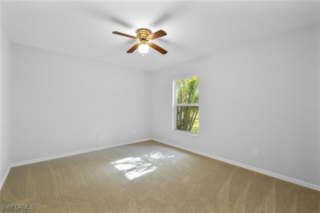 1401 NW 16th Pl, Cape Coral, FL 33993 - unfurnished room featuring carpet, ceiling fan, and baseboards