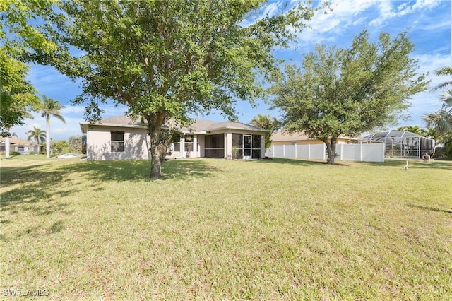 1401 NW 16th Pl, Cape Coral, FL 33993 - view of yard with a sunroom