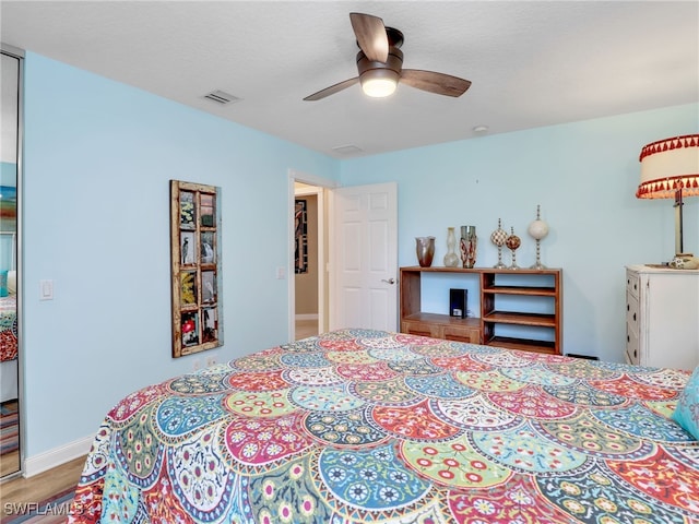 28902 Vermillion Ln, Bonita Springs, FL 34135 - bedroom with wood finished floors, ceiling fan, and baseboards