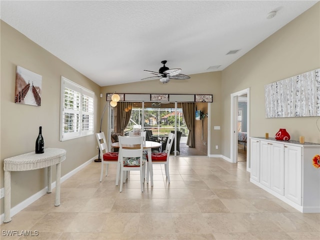28902 Vermillion Ln, Bonita Springs, FL 34135 - dining area with a ceiling fan, vaulted ceiling, healthy amount of natural light, and baseboards