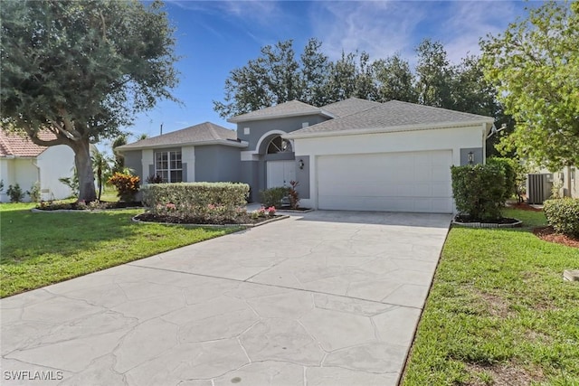 14831 Blackbird Ln, Fort Myers, FL 33919 - view of front of home with stucco siding, an attached garage, central air condition unit, a front yard, and driveway