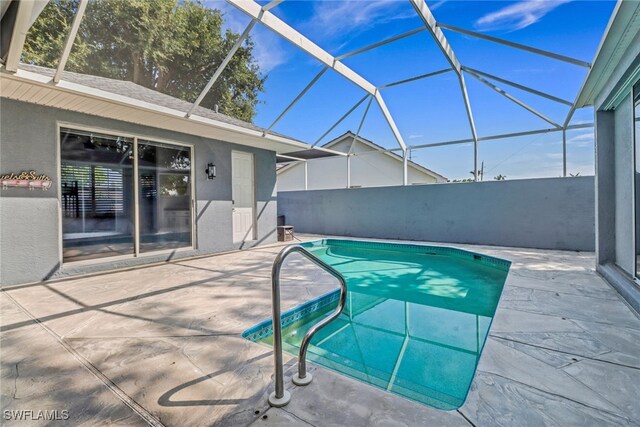 14831 Blackbird Ln, Fort Myers, FL 33919 - view of swimming pool featuring a patio area and glass enclosure