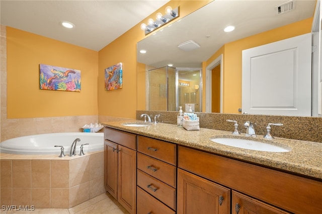 3414 Hancock Bridge Pkwy Unit 502, North Fort Myers, FL 33903 - bathroom featuring a bath, a stall shower, double vanity, and tile patterned flooring