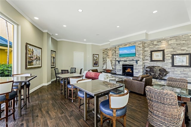 3414 Hancock Bridge Pkwy Unit 502, North Fort Myers, FL 33903 - dining space featuring recessed lighting, wood finished floors, a fireplace, baseboards, and ornamental molding