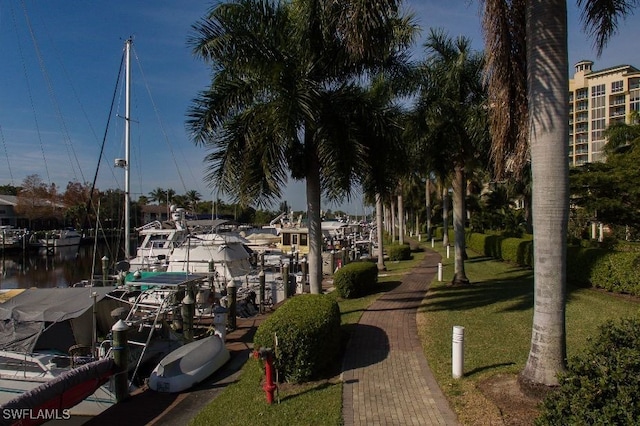 3414 Hancock Bridge Pkwy Unit 502, North Fort Myers, FL 33903 - view of property's community with a boat dock, a yard, and a water view