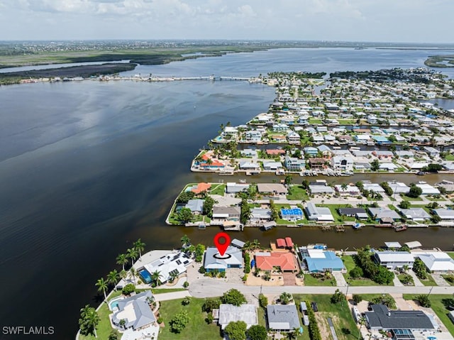 birds eye view of property featuring a water view and a residential view