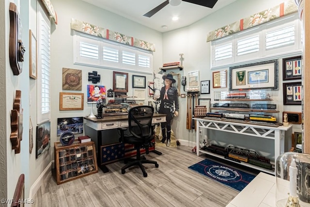 office featuring a ceiling fan, baseboards, recessed lighting, and wood finished floors