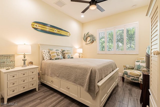 bedroom featuring ceiling fan, visible vents, dark wood finished floors, baseboards, and recessed lighting