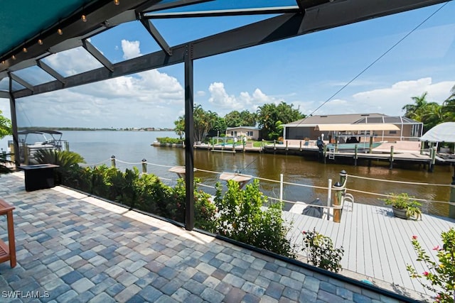 dock area with a water view and a patio area