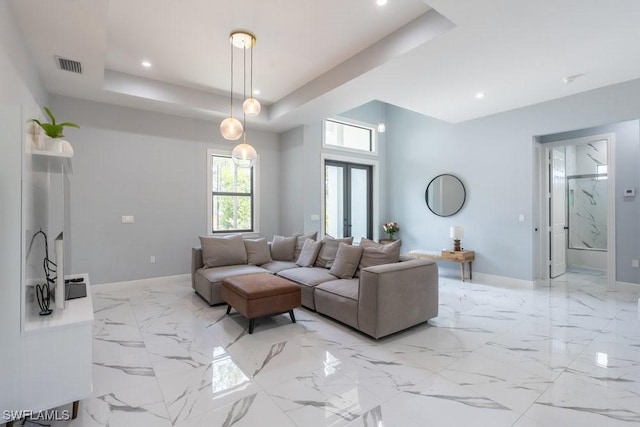 2625 27th Ave NE, Naples, FL 34120 - living room featuring baseboards, a raised ceiling, recessed lighting, and light marble finish flooring