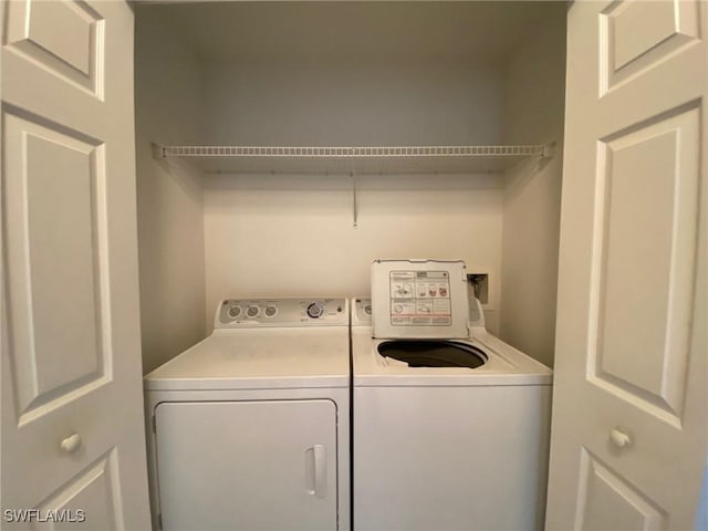 laundry room with independent washer and dryer