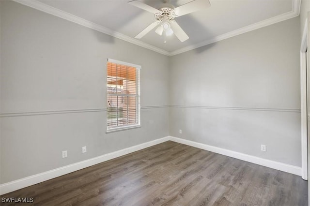 spare room with baseboards, ornamental molding, ceiling fan, and wood finished floors